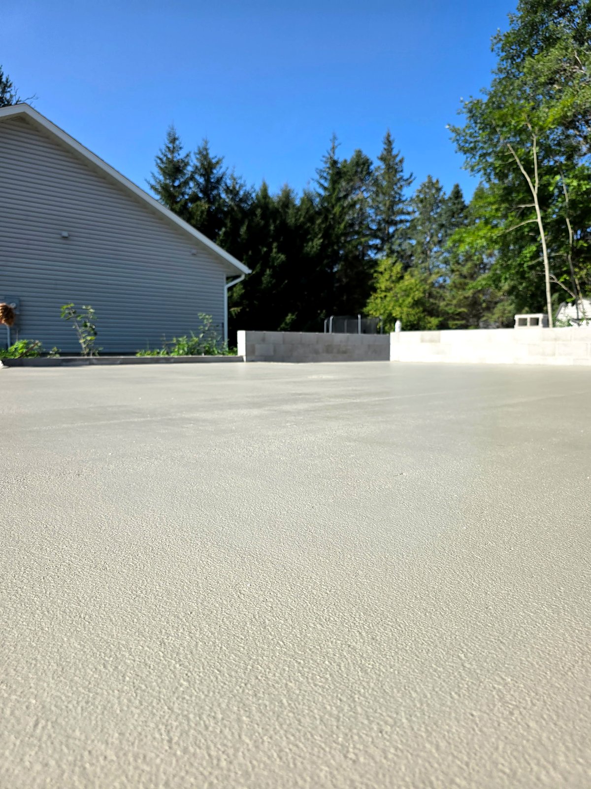 A smooth finished concrete slab beside new block walls